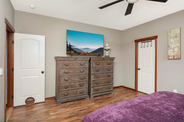 2349 175th Ln NE, Ham Lake, MN 55304 - bedroom featuring wood finished floors, a ceiling fan, and baseboards