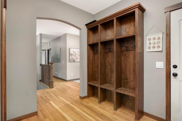 2349 175th Ln NE, Ham Lake, MN 55304 - mudroom featuring arched walkways, light wood-style flooring, and baseboards