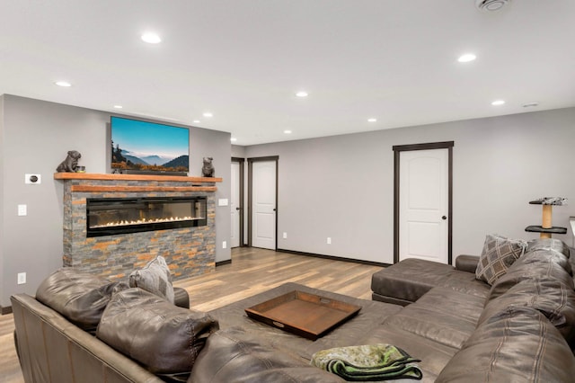 2349 175th Ln NE, Ham Lake, MN 55304 - living area featuring wood finished floors, recessed lighting, baseboards, and a stone fireplace