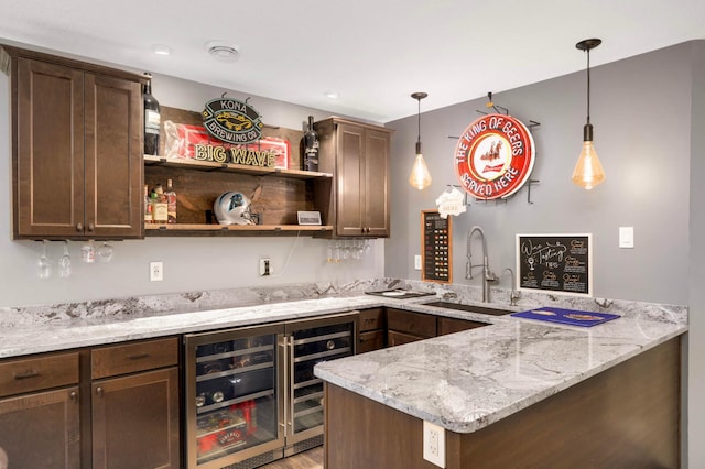 2349 175th Ln NE, Ham Lake, MN 55304 - indoor bar with beverage cooler, hanging light fixtures, and light wood finished floors