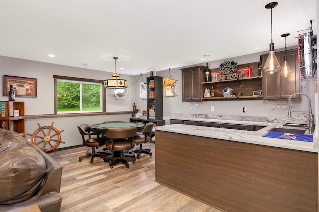 2349 175th Ln NE, Ham Lake, MN 55304 - bar area featuring a sink, light wood finished floors, pendant lighting, and recessed lighting