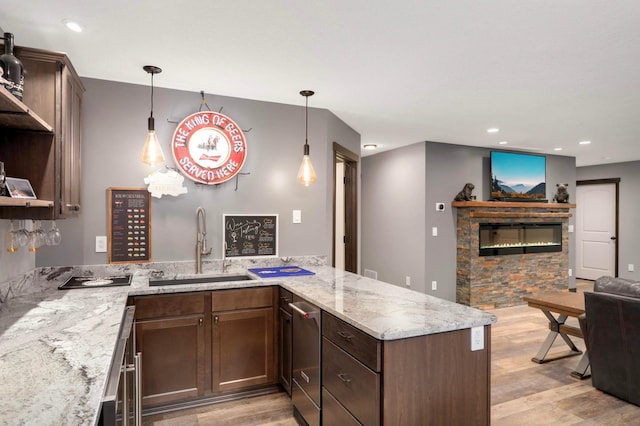 2349 175th Ln NE, Ham Lake, MN 55304 - kitchen featuring light wood-style flooring, a sink, a peninsula, open shelves, and open floor plan