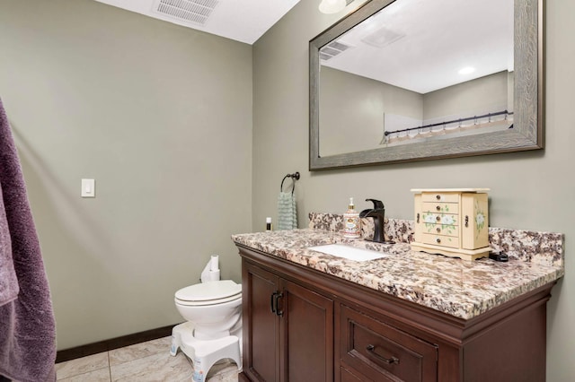 2349 175th Ln NE, Ham Lake, MN 55304 - bathroom featuring vanity, toilet, and tile patterned flooring
