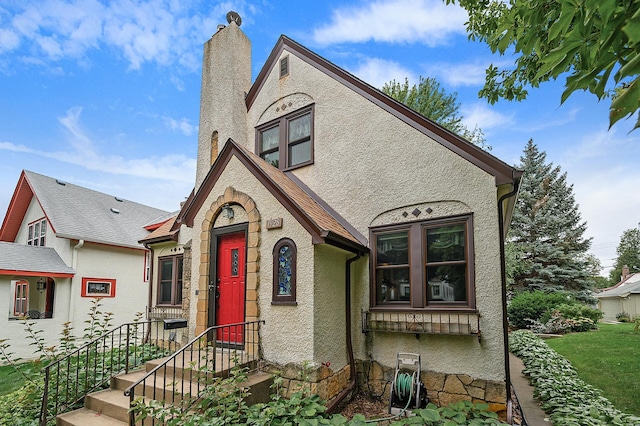 1928 Cleveland St NE, Minneapolis, MN 55418 - english style home featuring stucco siding and a chimney
