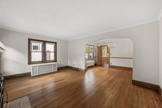 1928 Cleveland St NE, Minneapolis, MN 55418 - unfurnished living room featuring radiator heating unit, arched walkways, a chandelier, wood finished floors, and crown molding