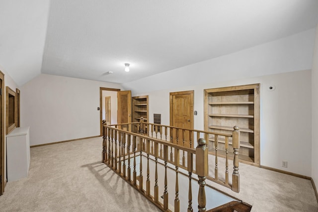 1928 Cleveland St NE, Minneapolis, MN 55418 - hallway featuring an upstairs landing, lofted ceiling, carpet, built in features, and baseboards
