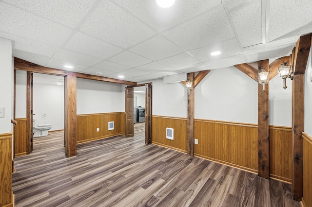 1928 Cleveland St NE, Minneapolis, MN 55418 - finished below grade area featuring wainscoting, wood finished floors, a drop ceiling, recessed lighting, and wood walls