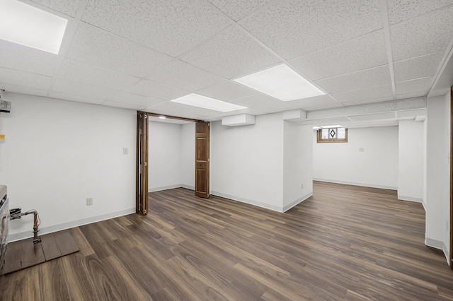 1928 Cleveland St NE, Minneapolis, MN 55418 - below grade area featuring dark wood-style floors, baseboards, and a drop ceiling
