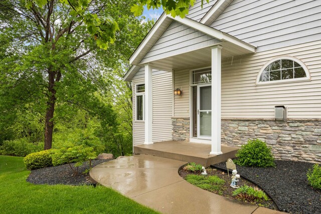 14550 Hunters Ln, Savage, MN 55378 - property entrance featuring stone siding and covered porch