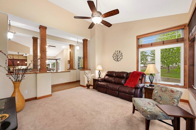 14550 Hunters Ln, Savage, MN 55378 - living area featuring a ceiling fan, ornate columns, carpet flooring, vaulted ceiling, and baseboards