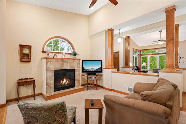 14550 Hunters Ln, Savage, MN 55378 - carpeted living area with decorative columns, ceiling fan, healthy amount of natural light, and lofted ceiling