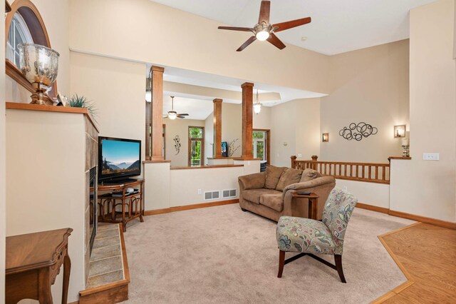 14550 Hunters Ln, Savage, MN 55378 - living room featuring ceiling fan, baseboards, and ornate columns