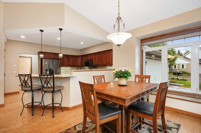 14550 Hunters Ln, Savage, MN 55378 - dining space with lofted ceiling, light wood-style flooring, baseboards, and recessed lighting