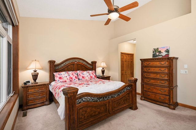 14550 Hunters Ln, Savage, MN 55378 - bedroom featuring light carpet, baseboards, a closet, lofted ceiling, and a ceiling fan