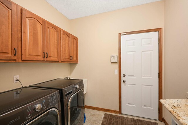 14550 Hunters Ln, Savage, MN 55378 - washroom featuring washer and dryer, cabinet space, and baseboards