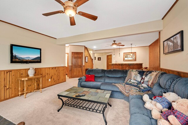 14550 Hunters Ln, Savage, MN 55378 - living room featuring wainscoting, ceiling fan, wooden walls, and carpet floors