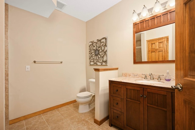 14550 Hunters Ln, Savage, MN 55378 - bathroom featuring baseboards, toilet, vanity, and tile patterned flooring