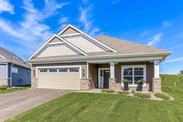 19171 Cottage Rd, Farmington, MN 55024 - craftsman-style house with asphalt driveway, a front yard, an attached garage, covered porch, and a shingled roof
