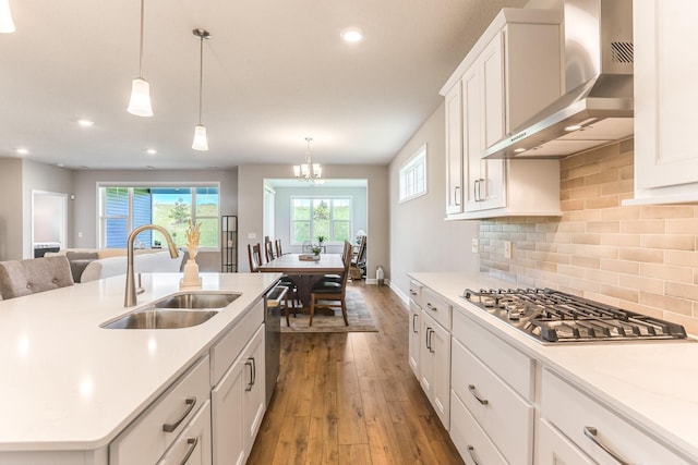19171 Cottage Rd, Farmington, MN 55024 - kitchen with wall chimney exhaust hood, a sink, stainless steel appliances, dark wood-type flooring, and recessed lighting