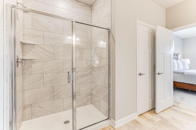 19171 Cottage Rd, Farmington, MN 55024 - bathroom featuring connected bathroom, a stall shower, and baseboards