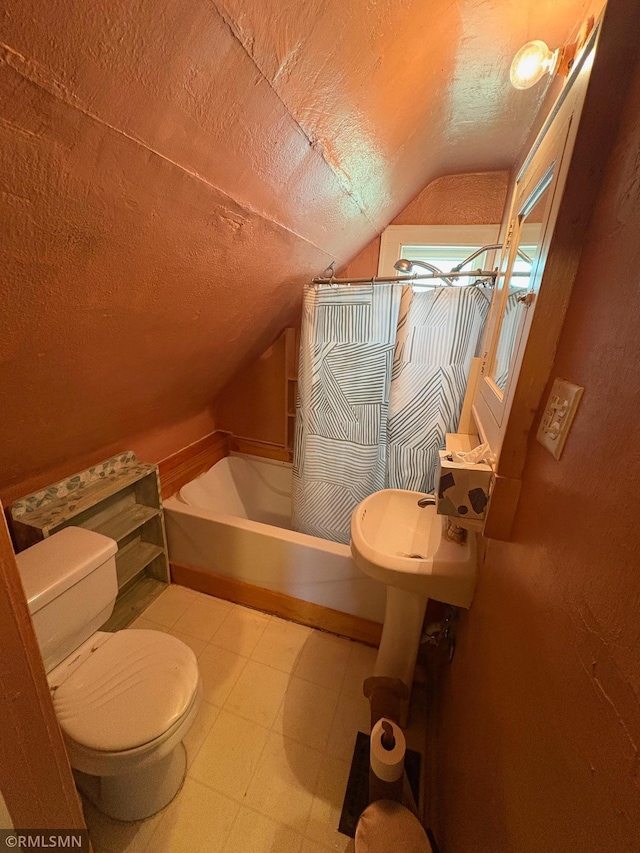 3934 Hubbard Ave N, Robbinsdale, MN 55422 - bathroom featuring lofted ceiling, toilet, a tub to relax in, tile patterned floors, and a textured ceiling