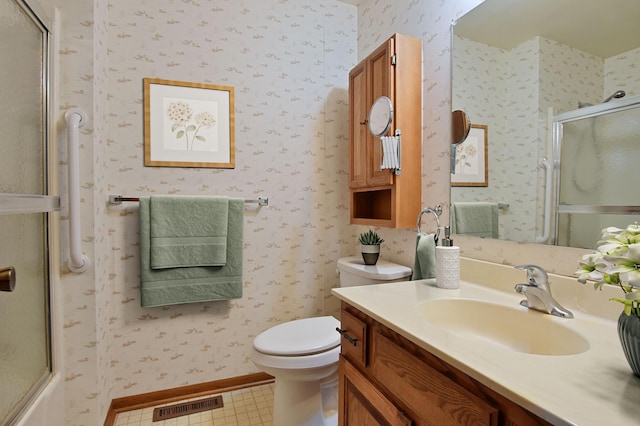1871 Livingston Ave Unit C, West Saint Paul, MN 55118 - bathroom featuring vanity, toilet, and wallpapered walls