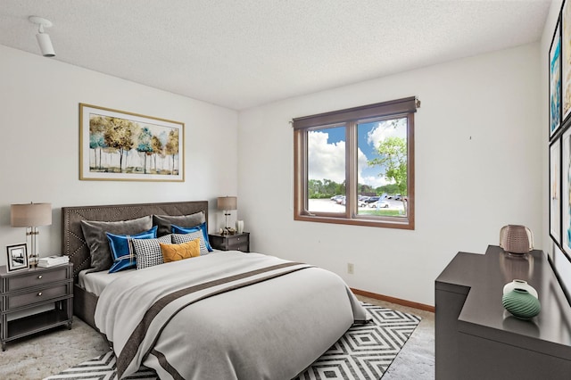 1871 Livingston Ave Unit C, West Saint Paul, MN 55118 - bedroom with a textured ceiling, baseboards, and light colored carpet
