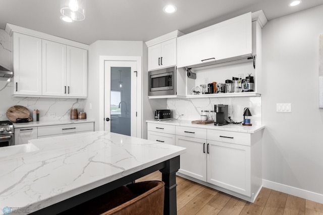4533 38 1/2 Ave N, Reiles Acres, ND 58102 - kitchen with stainless steel appliances, recessed lighting, backsplash, open shelves, and white cabinetry