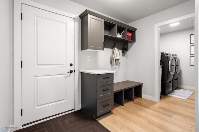4533 38 1/2 Ave N, Reiles Acres, ND 58102 - mudroom featuring washer and dryer, light wood finished floors, and baseboards