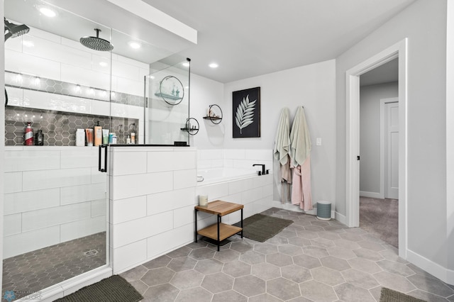 4533 38 1/2 Ave N, Reiles Acres, ND 58102 - bathroom with a shower stall, a garden tub, tile patterned floors, recessed lighting, and baseboards