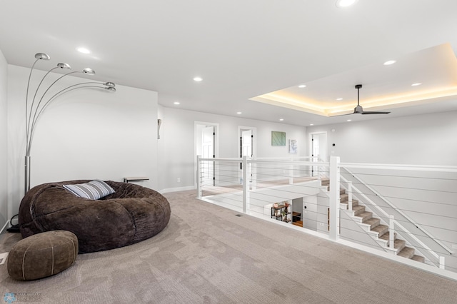 4533 38 1/2 Ave N, Reiles Acres, ND 58102 - living area featuring carpet, recessed lighting, ceiling fan, a raised ceiling, and an upstairs landing
