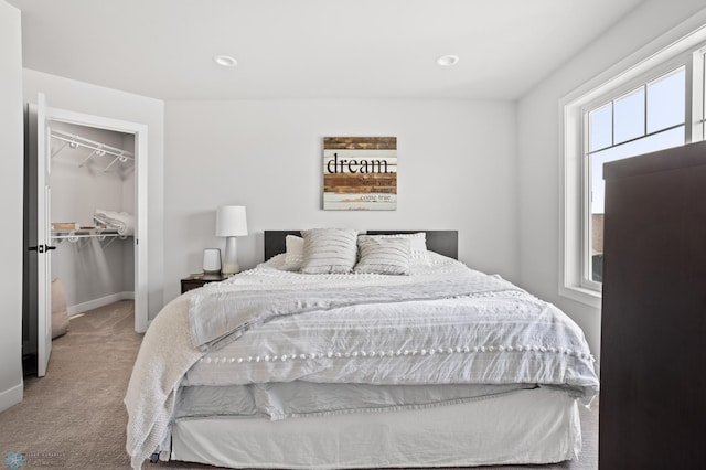4533 38 1/2 Ave N, Reiles Acres, ND 58102 - bedroom with carpet floors, baseboards, a walk in closet, recessed lighting, and a closet