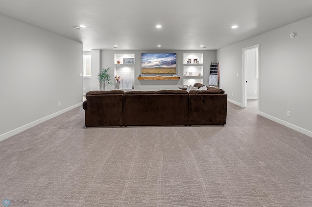4533 38 1/2 Ave N, Reiles Acres, ND 58102 - carpeted living room with baseboards, recessed lighting, and built in features