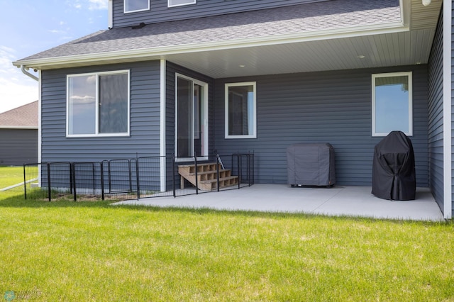 4533 38 1/2 Ave N, Reiles Acres, ND 58102 - rear view of property with entry steps, a patio area, and roof with shingles