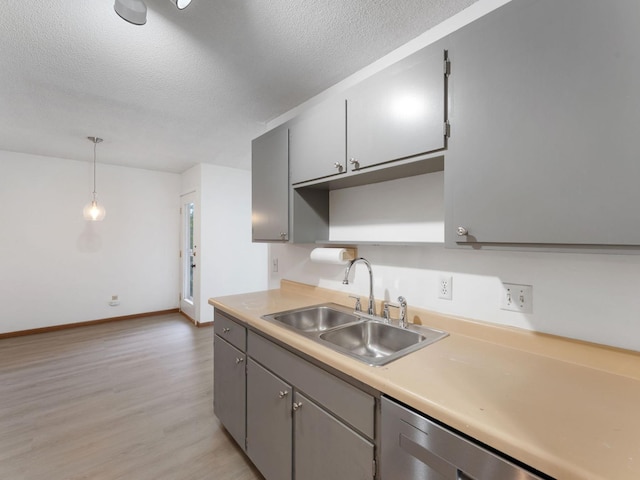 26 Arthur Ave SE Unit 304, Minneapolis, MN 55414 - kitchen featuring a sink, dishwasher, a textured ceiling, light wood finished floors, and gray cabinetry