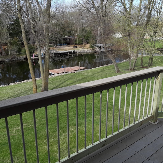 527 Riverview Dr, Waterville, MN 56096 - wooden deck featuring a water view, a yard, and a floating dock