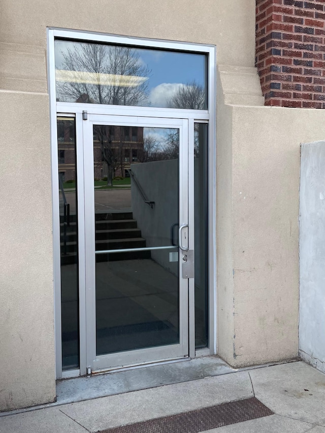 109 Luverne St Unit 220, Luverne, MN 56156 - doorway to property with stucco siding