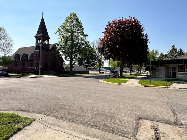 109 Luverne St Unit 220, Luverne, MN 56156 - view of asphalt road featuring curbs and sidewalks