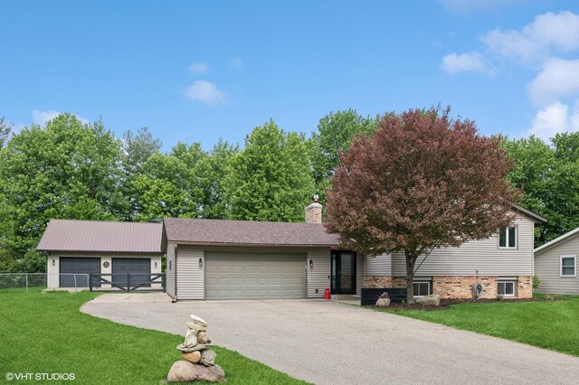 1408 Lower Heritage Way, Farmington, MN 55024 - view of front of house with a chimney, driveway, and an attached garage