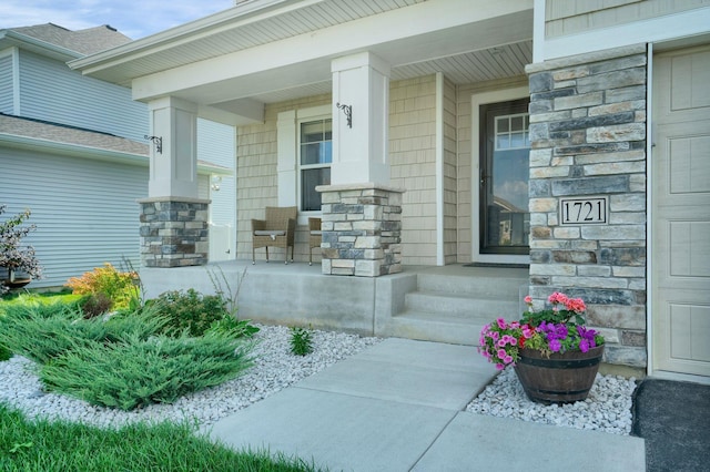 1721 Pebblestone Rd, Carver, MN 55315 - view of exterior entry featuring covered porch and stone siding