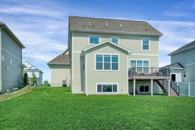1721 Pebblestone Rd, Carver, MN 55315 - back of house with stairs, a deck, a lawn, and central AC