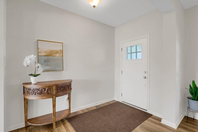 1721 Pebblestone Rd, Carver, MN 55315 - entryway with wood finished floors and baseboards