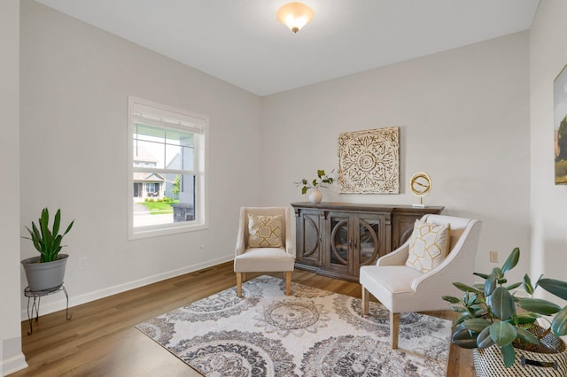 1721 Pebblestone Rd, Carver, MN 55315 - sitting room featuring wood finished floors and baseboards