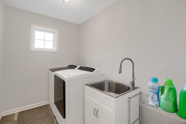 1721 Pebblestone Rd, Carver, MN 55315 - laundry room featuring washer and dryer, cabinet space, and baseboards