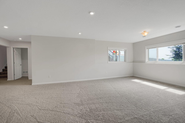 1721 Pebblestone Rd, Carver, MN 55315 - spare room featuring baseboards, carpet, and recessed lighting