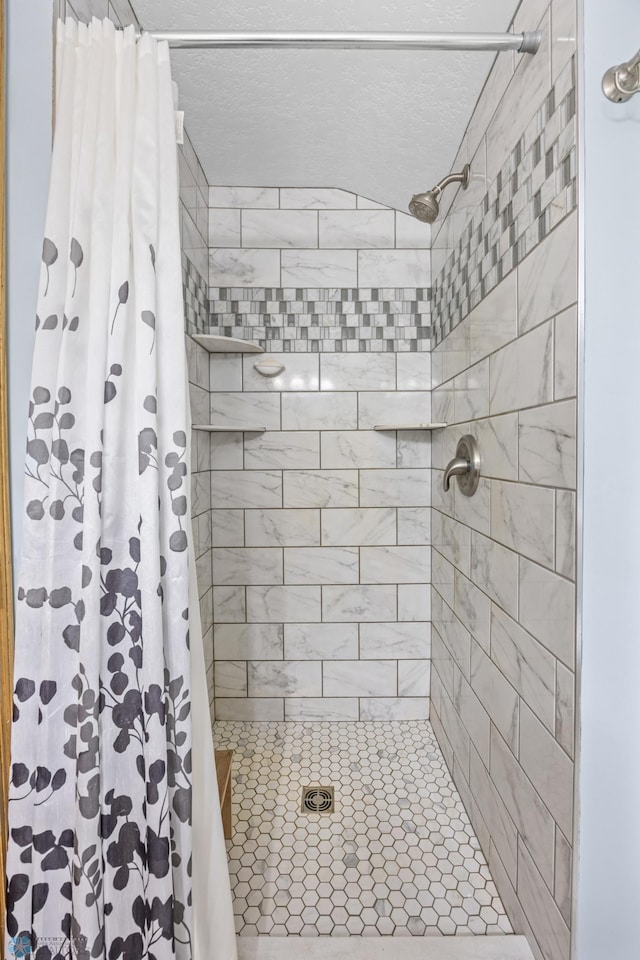 20482 28th Ave N, Cromwell Twp, MN 56549 - full bathroom featuring tiled shower and a textured ceiling