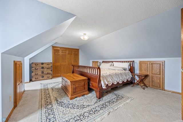 20482 28th Ave N, Cromwell Twp, MN 56549 - bedroom featuring light colored carpet, lofted ceiling, and a textured ceiling