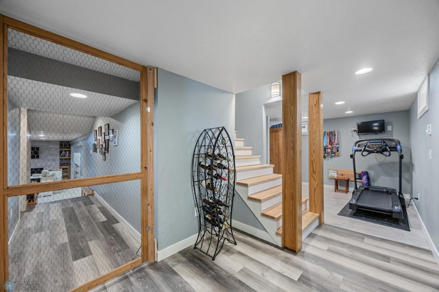 20482 28th Ave N, Cromwell Twp, MN 56549 - stairway with wood finished floors, baseboards, and recessed lighting
