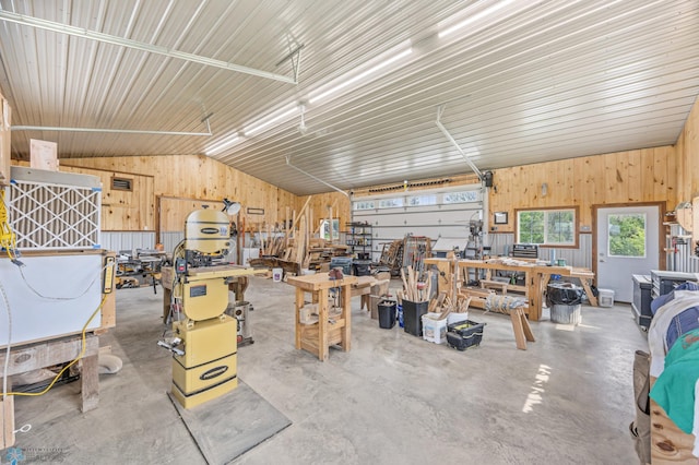 20482 28th Ave N, Cromwell Twp, MN 56549 - garage featuring a workshop area and wood walls