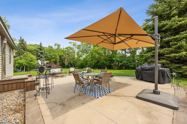 20482 28th Ave N, Cromwell Twp, MN 56549 - view of patio featuring outdoor dining area, view of scattered trees, and a grill